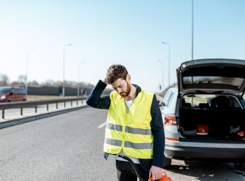 man-with-refuel-canister-on-the-roadside-AXNVVPQ